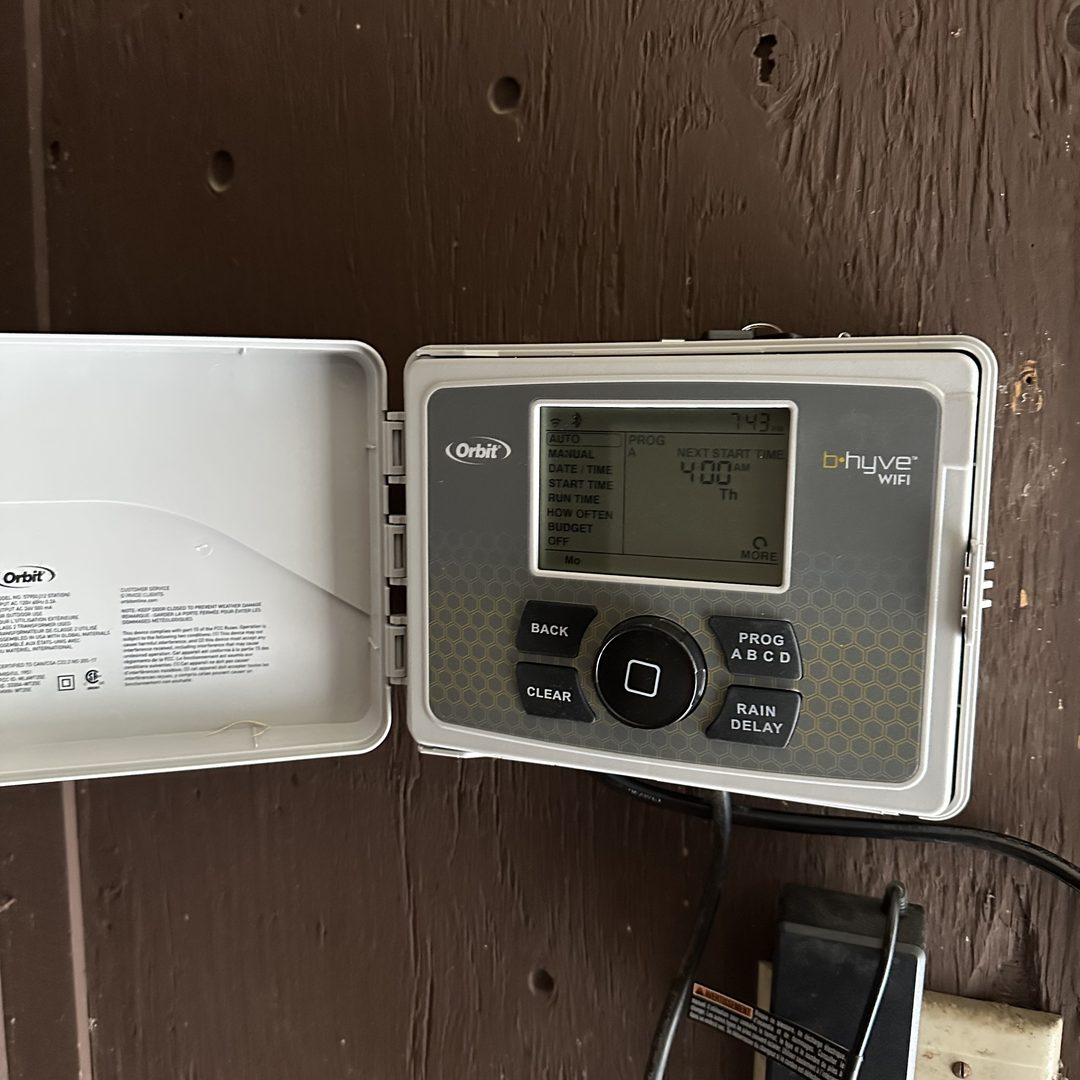 Orbit B-hyve Wi-Fi smart sprinkler controller mounted and wired